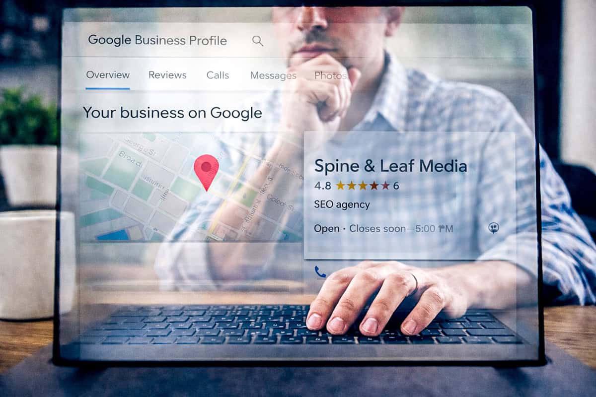 A small business owner sits at the computer completing his Google Business Profile to boost local SEO for small business.