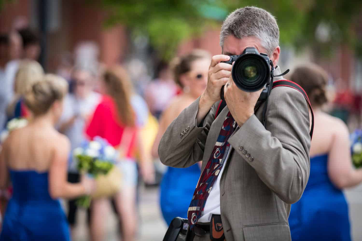 Image of a man pointing his camera at you. Spine & Leaf Media provides business photography and video for small businesses in Eastern North Carolina to improve your online performance.